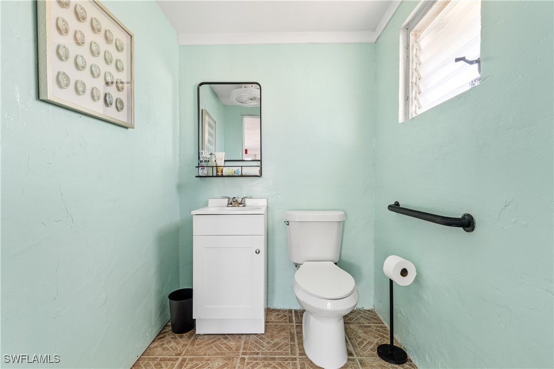 4673 Pine Island Road Matlacha, FL 33993 - Photo 23 of 29 a bathroom with a toilet and a sink