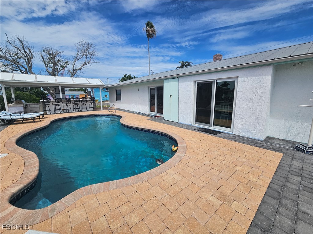 4673 Pine Island Road Matlacha, FL 33993 - Photo 3 of 29 a view of a swimming pool with a patio