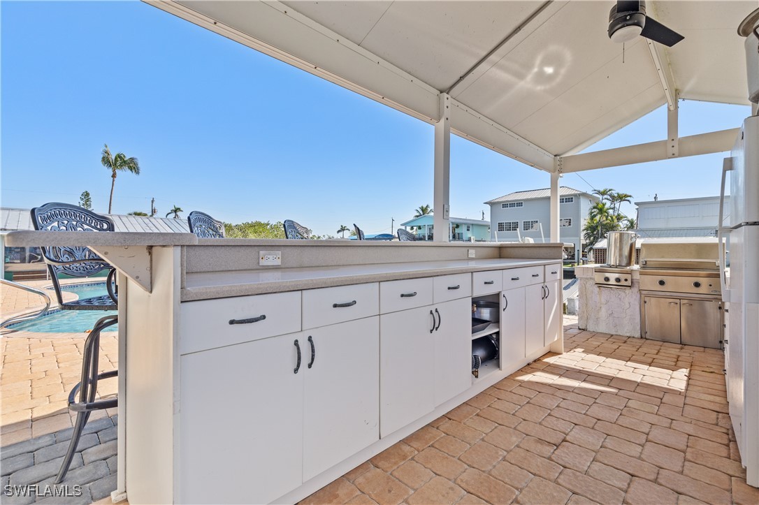 4673 Pine Island Road Matlacha, FL 33993 - Photo 6 of 29 a kitchen with cabinets and window