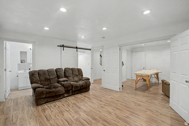 12645 East Cedar Ridge Drive Fairview, UT 84629 - Photo 25 of 34 Expansive room featuring wood-finish flooring, white walls, and recessed lighting