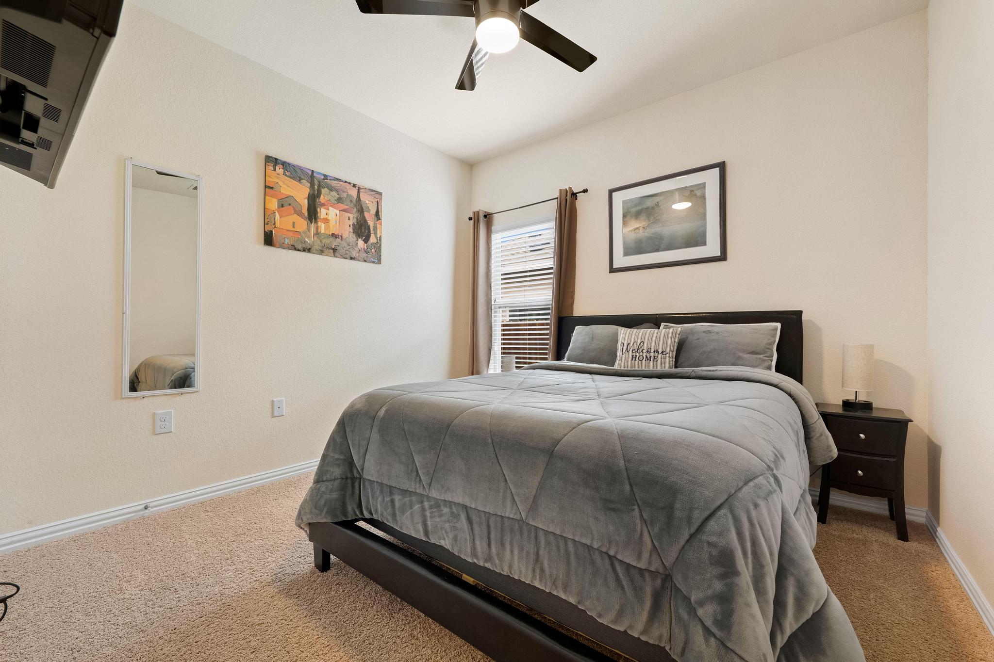 6905 Vail Ridge Street Austin, TX 78744 - Photo 17 of 39 1 of 4 main-level bedrooms, complete with ceiling fan