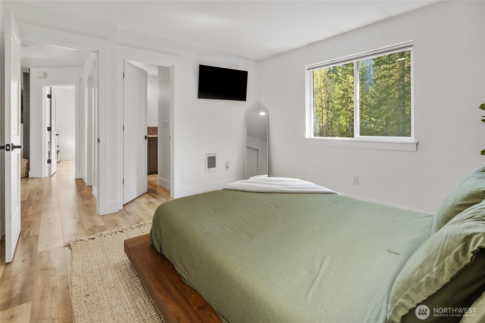 630 Silver Creek Road Easton, WA 98925 - Photo 21 of 40 a bedroom with a bed and a flat screen tv