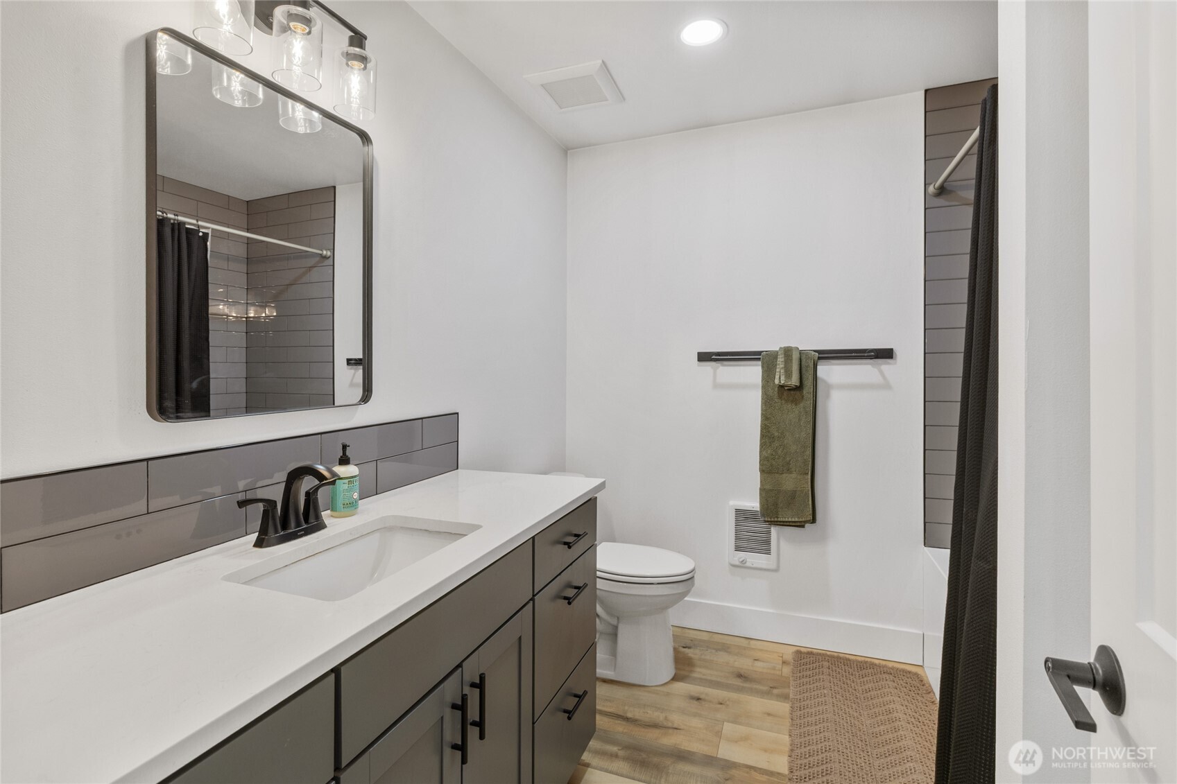 630 Silver Creek Road Easton, WA 98925 - Photo 22 of 40 a bathroom with a toilet sink and mirror