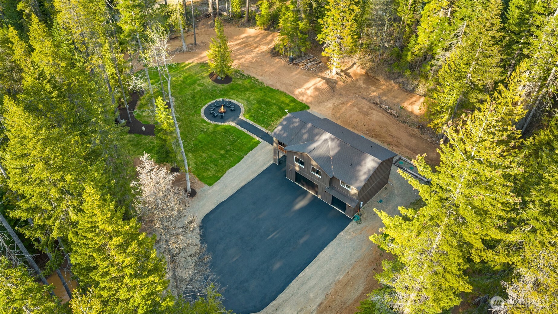 630 Silver Creek Road Easton, WA 98925 - Photo 32 of 40 a view of a house with a yard
