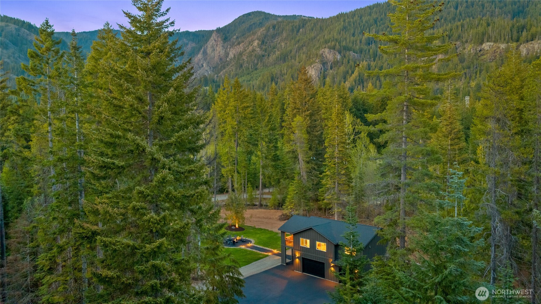630 Silver Creek Road Easton, WA 98925 - Photo 7 of 40 a view of a yard with a tree