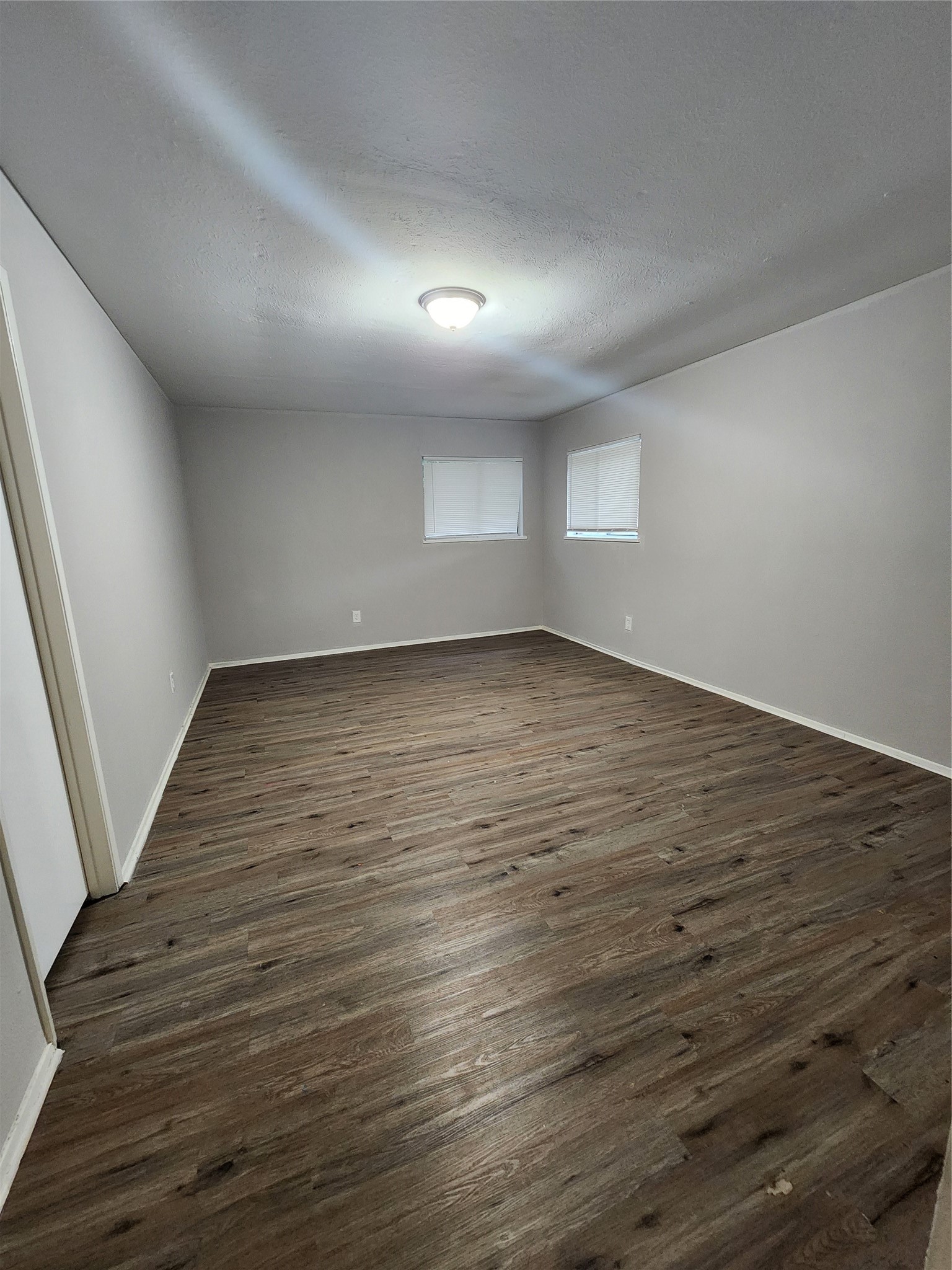 3822 Broken Elm Drive Spring, TX 77388 - Photo 15 of 25 an empty room with wooden floor and windows