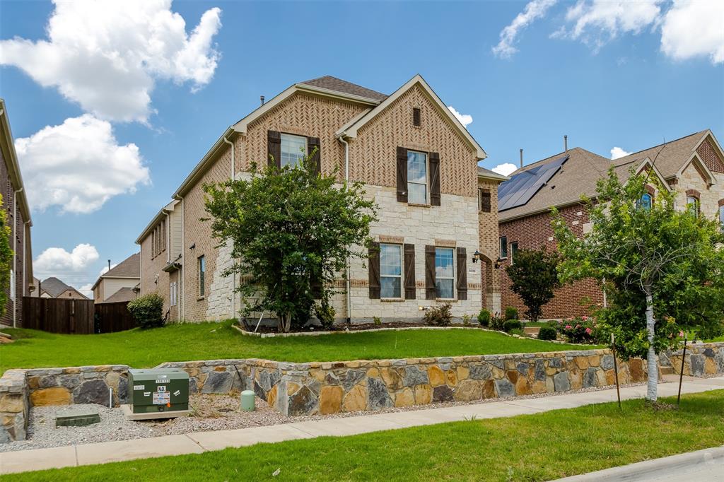 6333 Hall Road Frisco, TX 75034 - Photo 3 of 38 Two-story home with a brick and stone facade