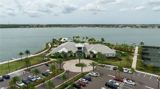 an aerial view of a house with a ocean view