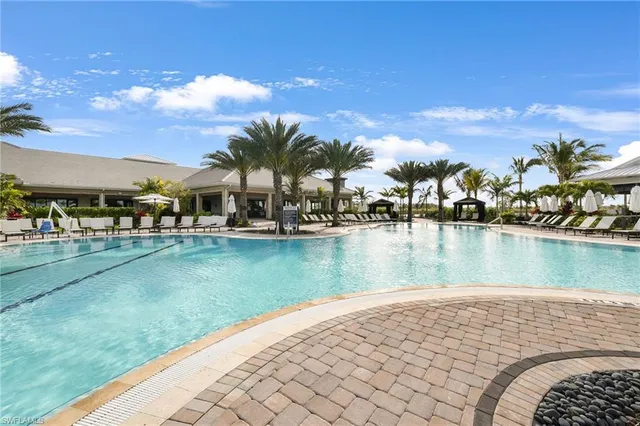 a view of swimming pool from a lake view