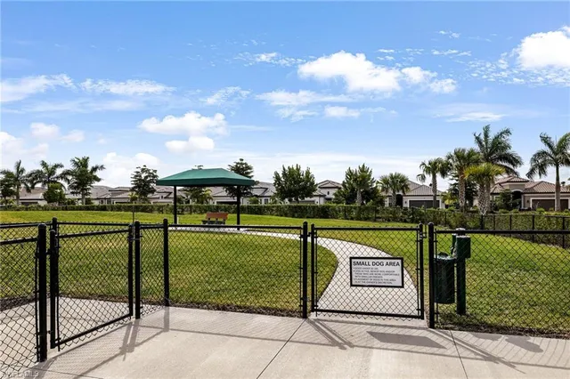 a living room with lots of furniture and view of kitchen
