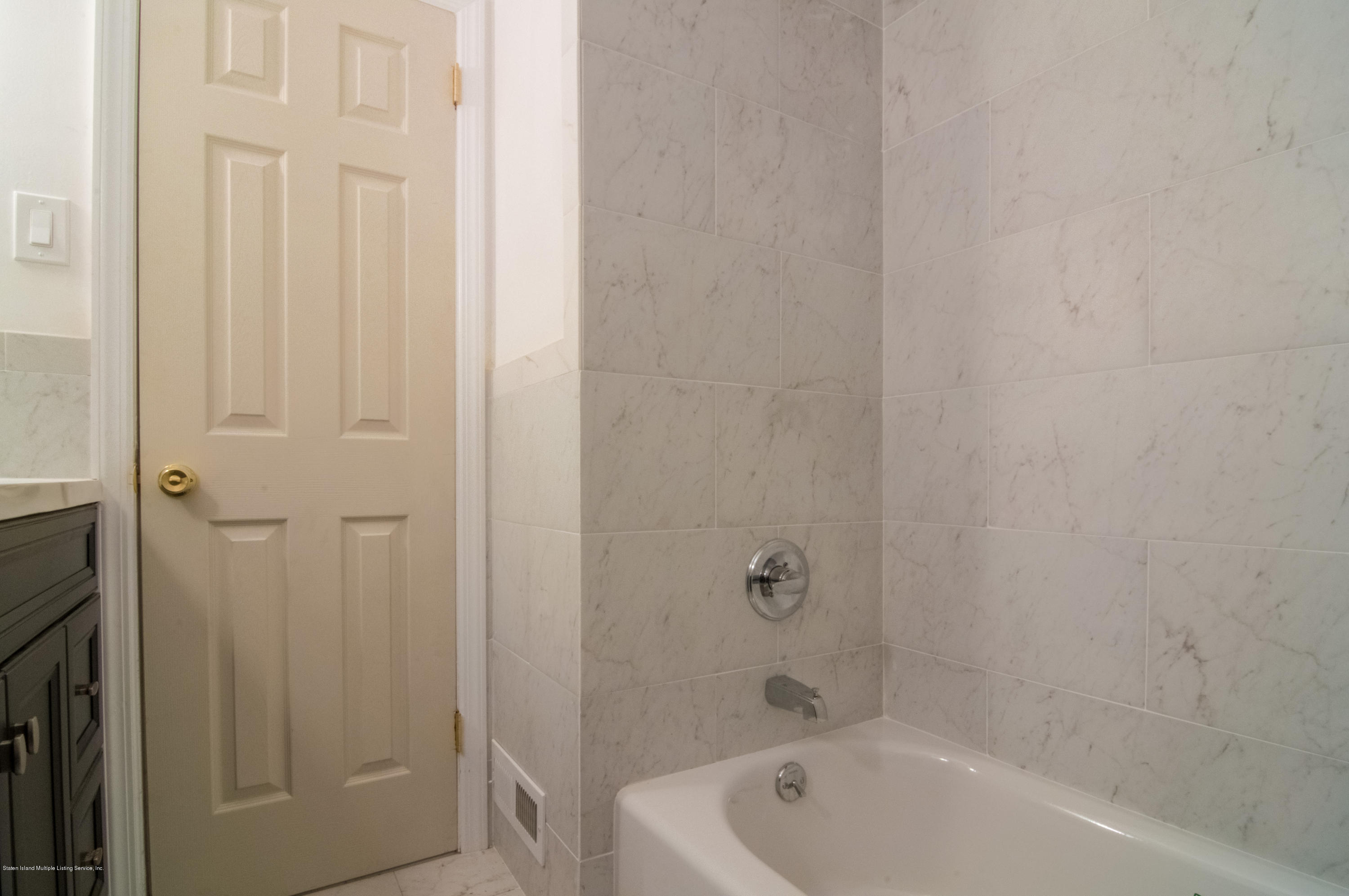 3298 Amboy Road Staten Island, NY 10306 - Photo 12 of 16 a bathroom with a tub