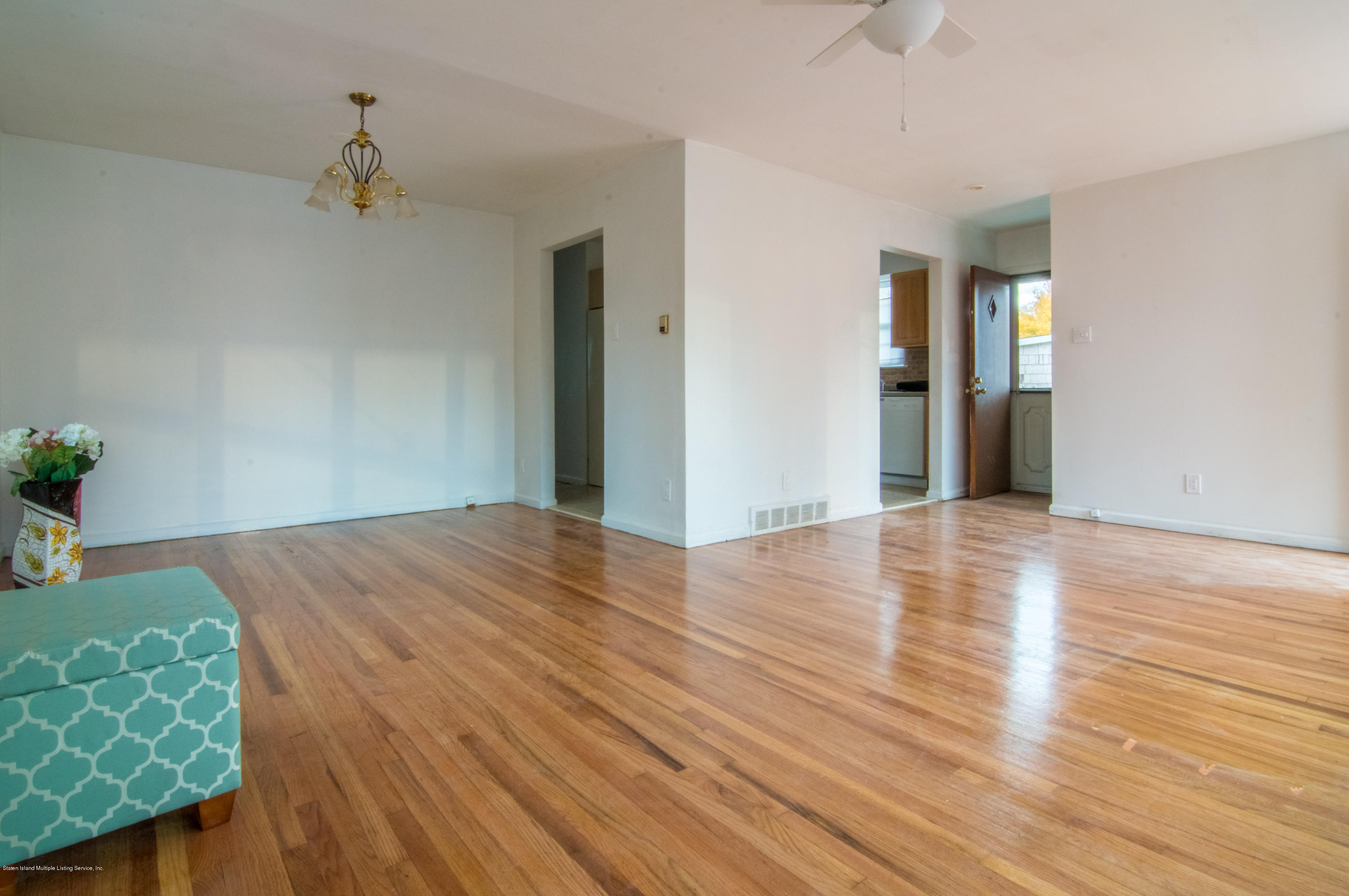 3298 Amboy Road Staten Island, NY 10306 - Photo 5 of 16 a view of empty room with wooden floor