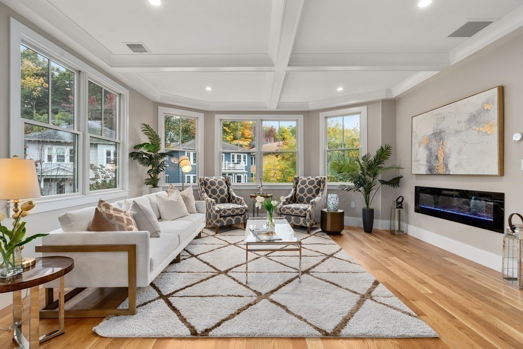 96 Verndale Street, Unit 2 Brookline, MA 02446 - Photo 11 of 31 a living room with furniture a large window and a table