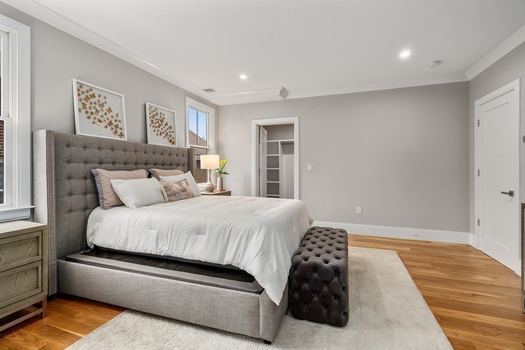 96 Verndale Street, Unit 2 Brookline, MA 02446 - Photo 15 of 31 a bedroom with a bed and a painting on the wall