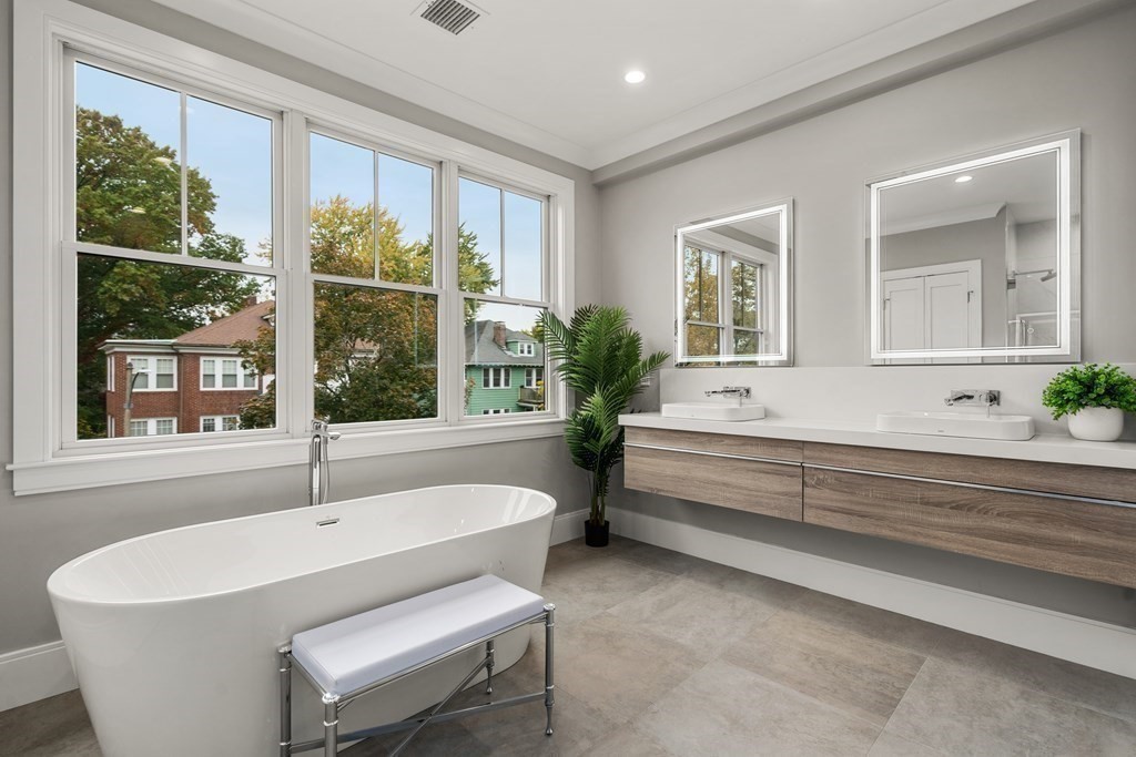 96 Verndale Street, Unit 2 Brookline, MA 02446 - Photo 16 of 31 a bathroom with a bathtub and window