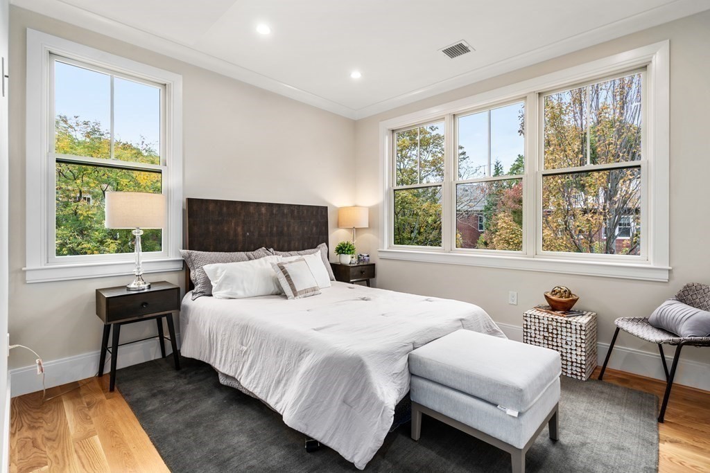 96 Verndale Street, Unit 2 Brookline, MA 02446 - Photo 17 of 31 a bedroom with a bed and a large window