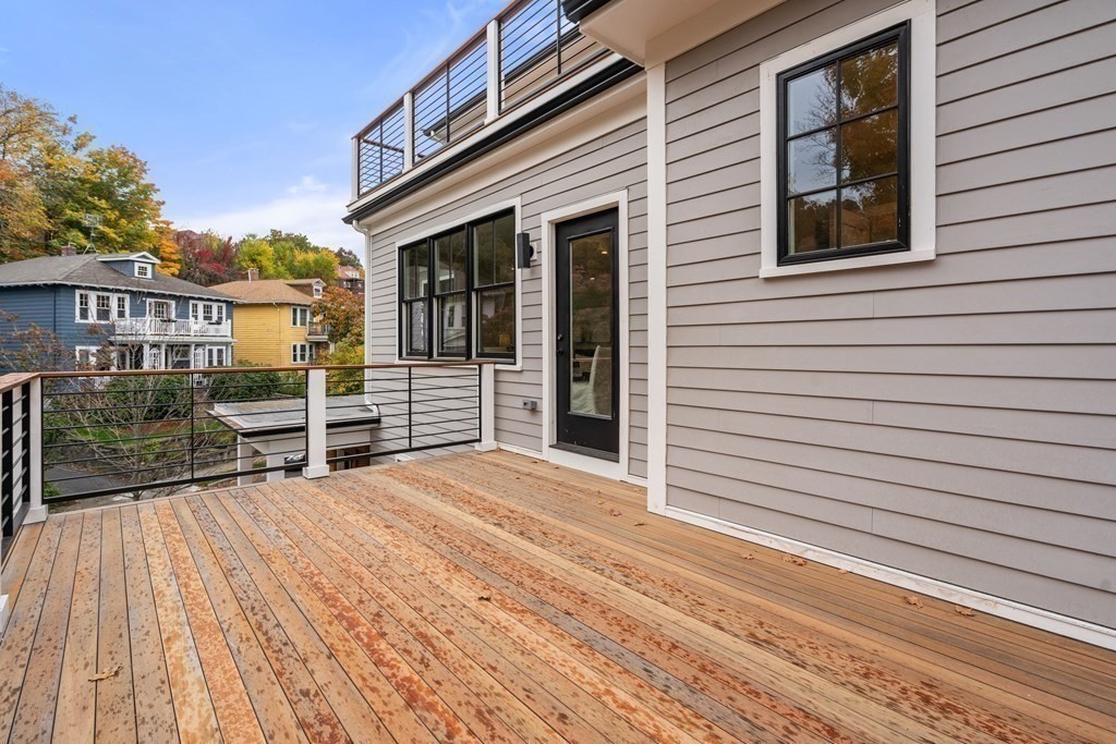 96 Verndale Street, Unit 2 Brookline, MA 02446 - Photo 19 of 31 a view of a house with barbeque and wooden floor