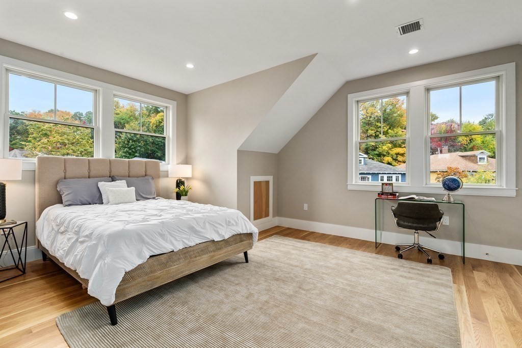 96 Verndale Street, Unit 2 Brookline, MA 02446 - Photo 21 of 31 a spacious bedroom with a bed and a window