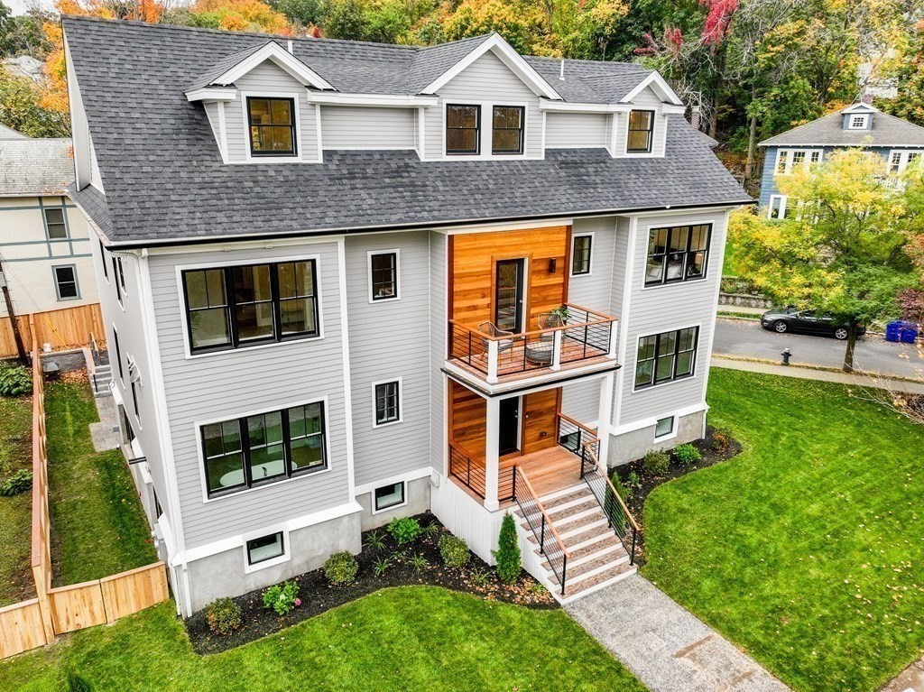96 Verndale Street, Unit 2 Brookline, MA 02446 - Photo 25 of 31 a front view of a house with a yard