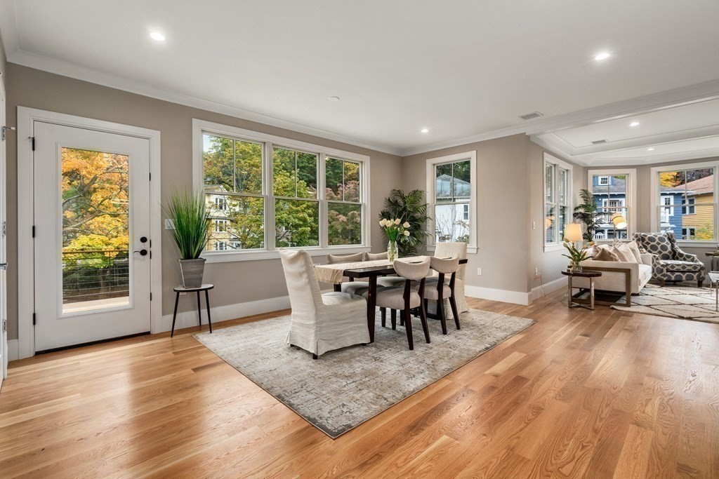 96 Verndale Street, Unit 2 Brookline, MA 02446 - Photo 9 of 31 a view of a dining room with furniture and wooden floor