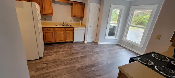 a kitchen with a stove and a refrigerator