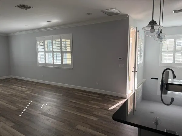 a kitchen with kitchen island a sink appliances and a counter space
