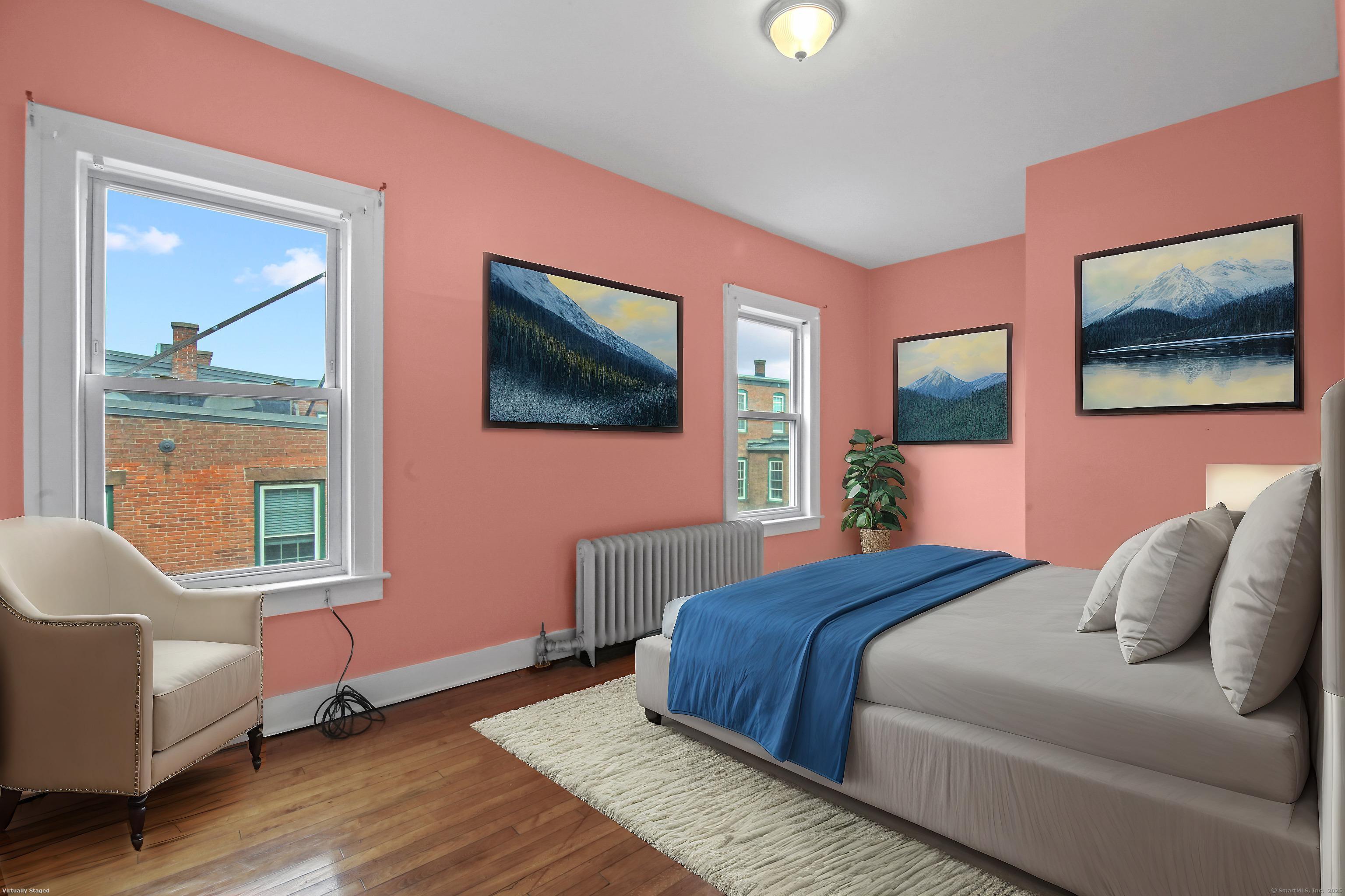 360 Main Street, Unit 3B Middletown, CT 06457 - Photo 4 of 24 a bedroom with a bed wooden floor and window