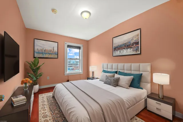 a bedroom with bed and window