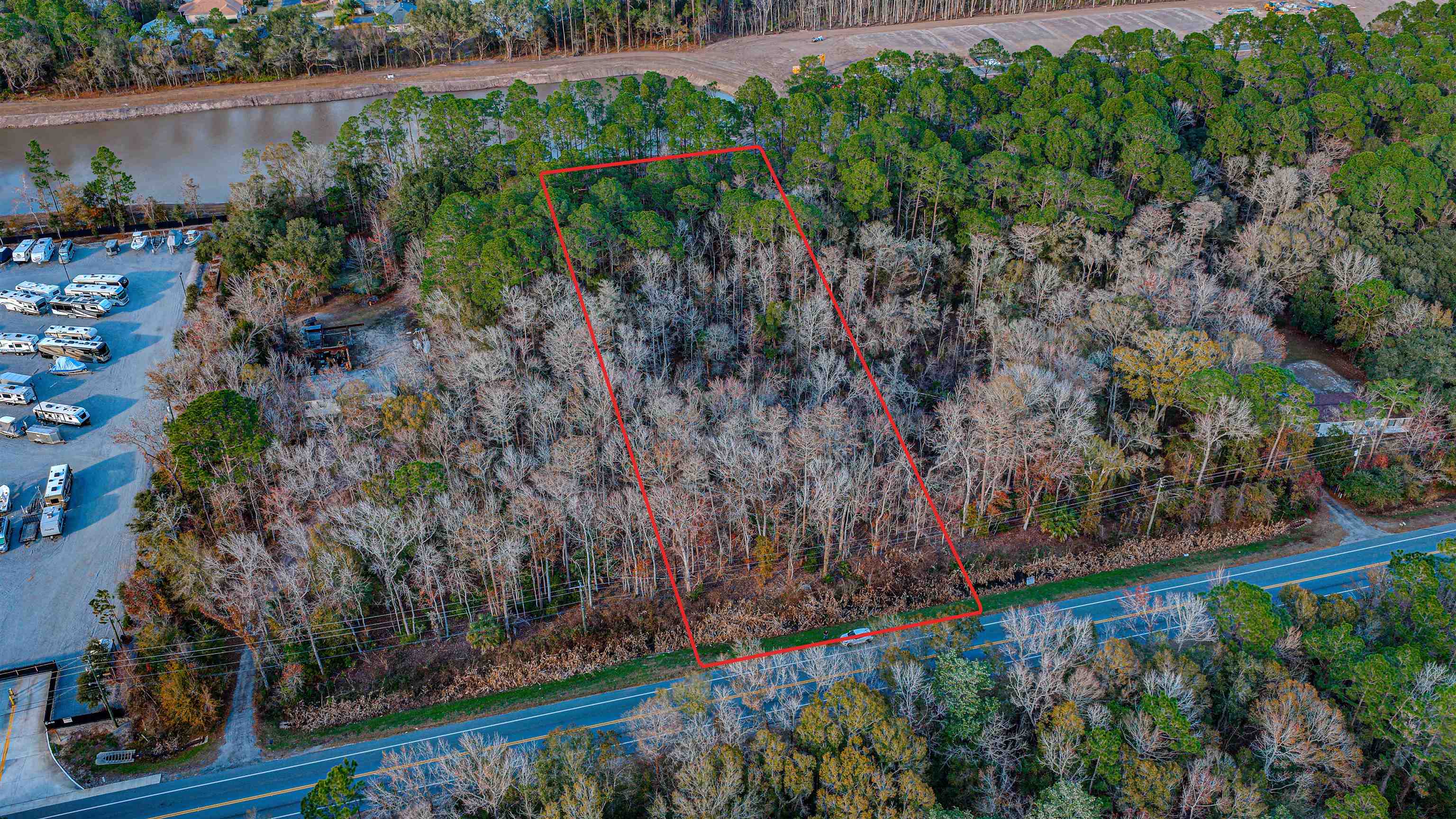 0 State Road 206 St. Augustine, FL 32086 - Photo 2 of 27 a view of a garden with plants and large trees
