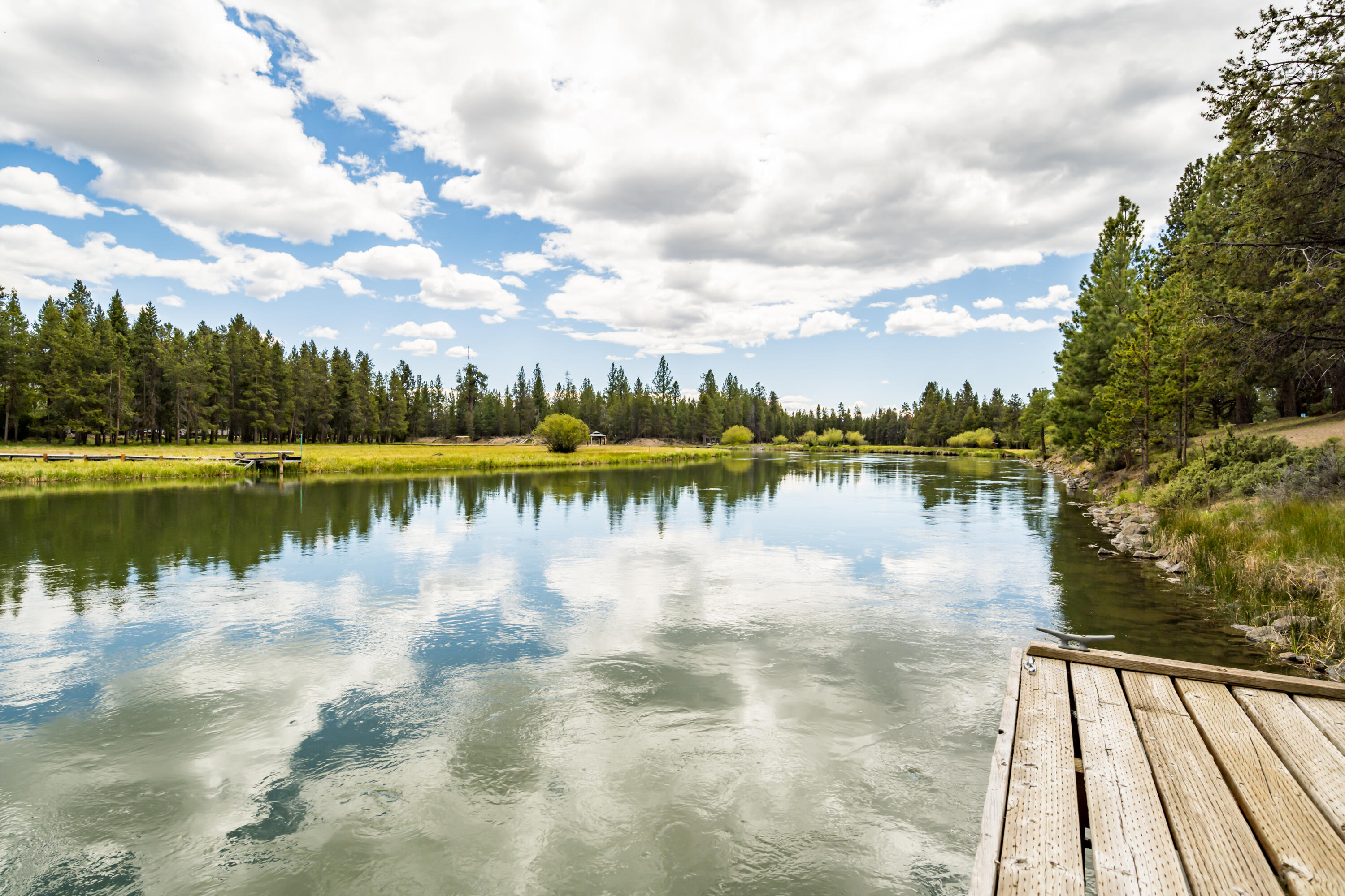 17026 Sharp Drive Bend, OR 97707 - Photo 13 of 72 a view of a lake with houses in the back