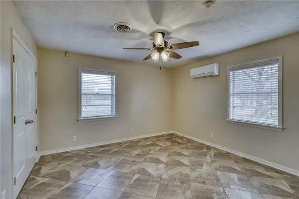 a view of an empty room with a window