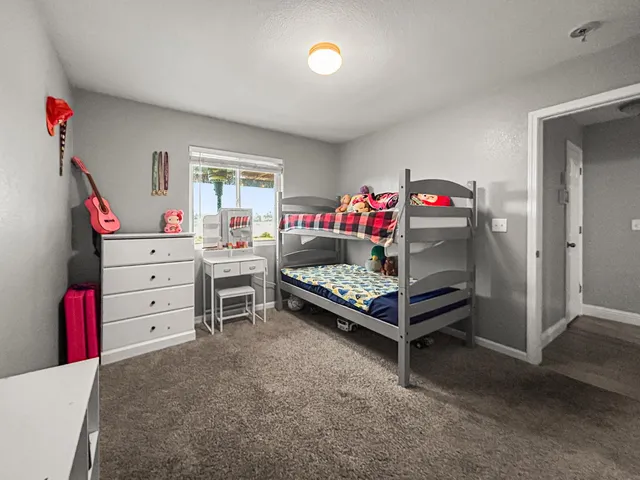 a bedroom with furniture and a window