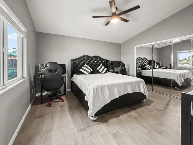 a bedroom with a bed and furniture