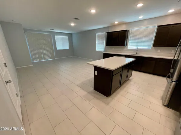 a kitchen with stainless steel appliances a microwave and white cabinets