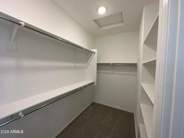 a view of an empty walk in closet