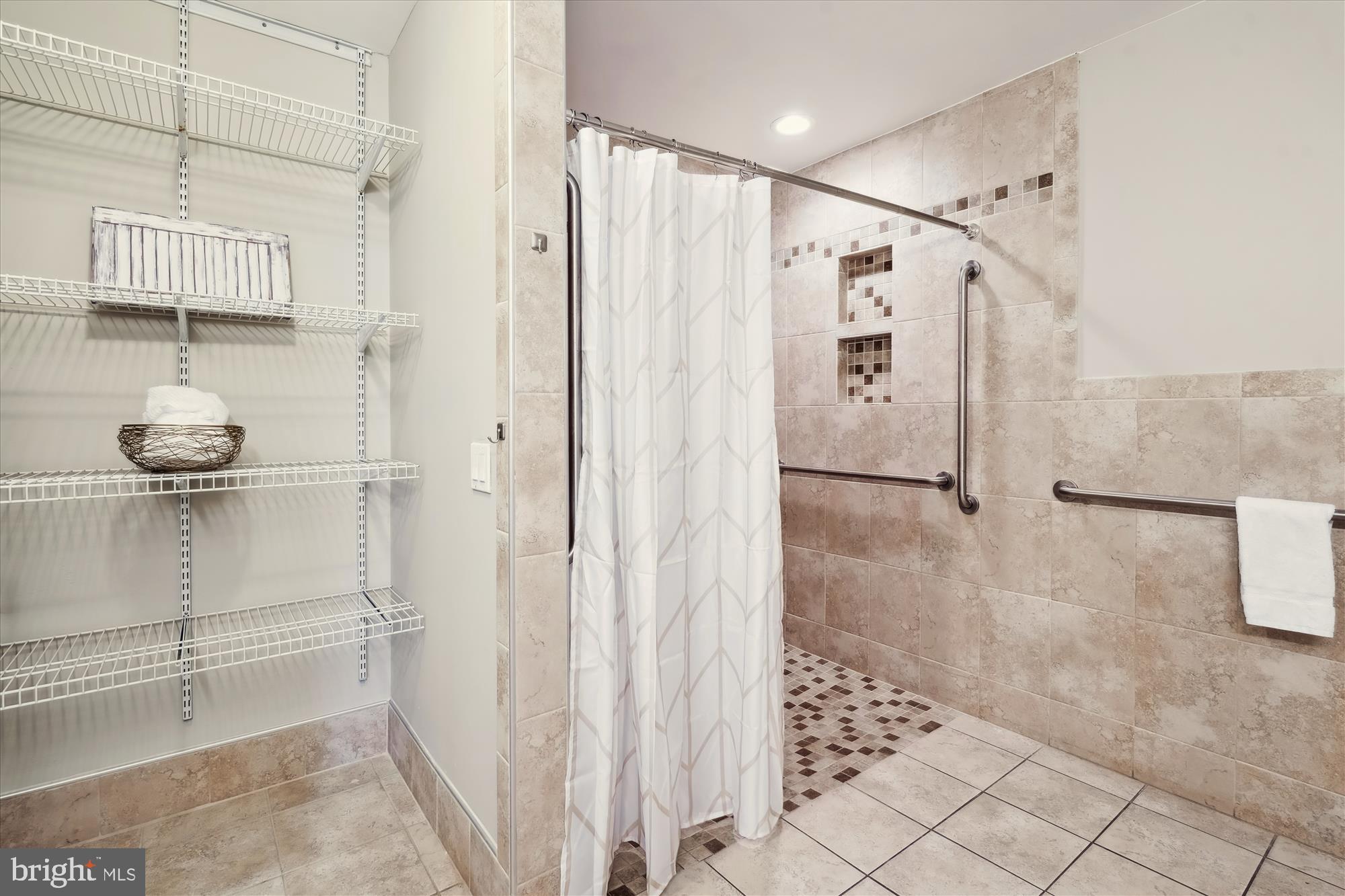 15705 Bond Mill Road Laurel, MD 20707 - Photo 54 of 77 LINEN SHELVING & ROLL-IN SHOWER W/ TOILETRY NICHES