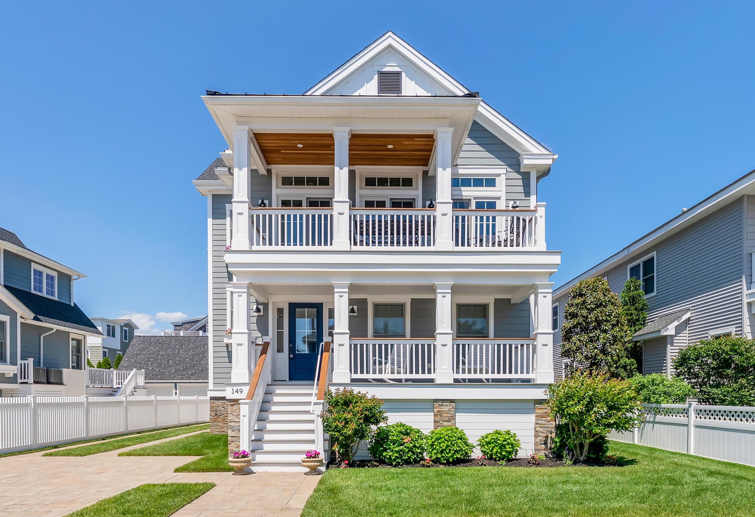 149 10th Street Avalon, NJ 08202 - Photo 1 of 49 a front view of a house with a yard