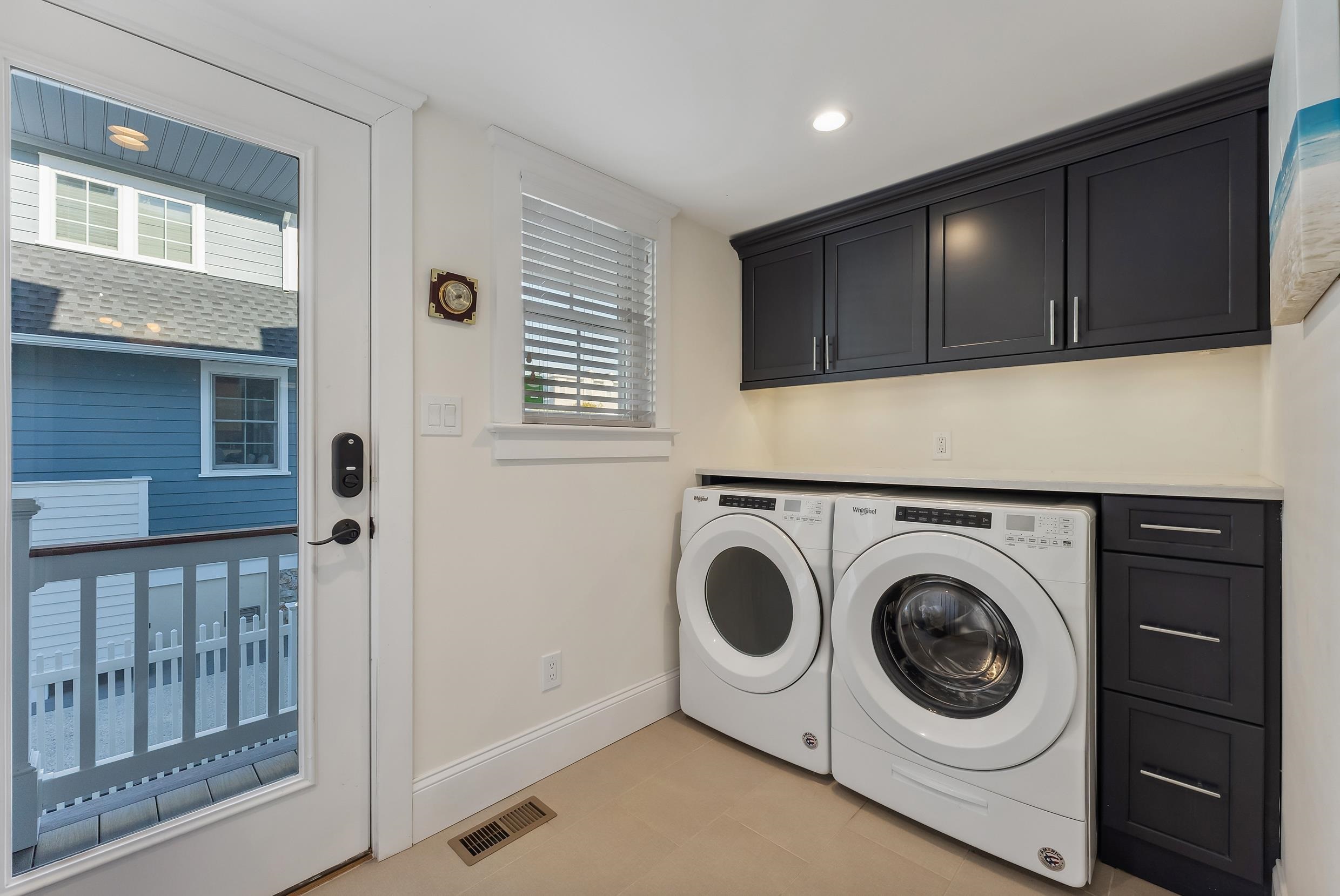 149 10th Street Avalon, NJ 08202 - Photo 19 of 49 a utility room with wooden floor washer and dryer