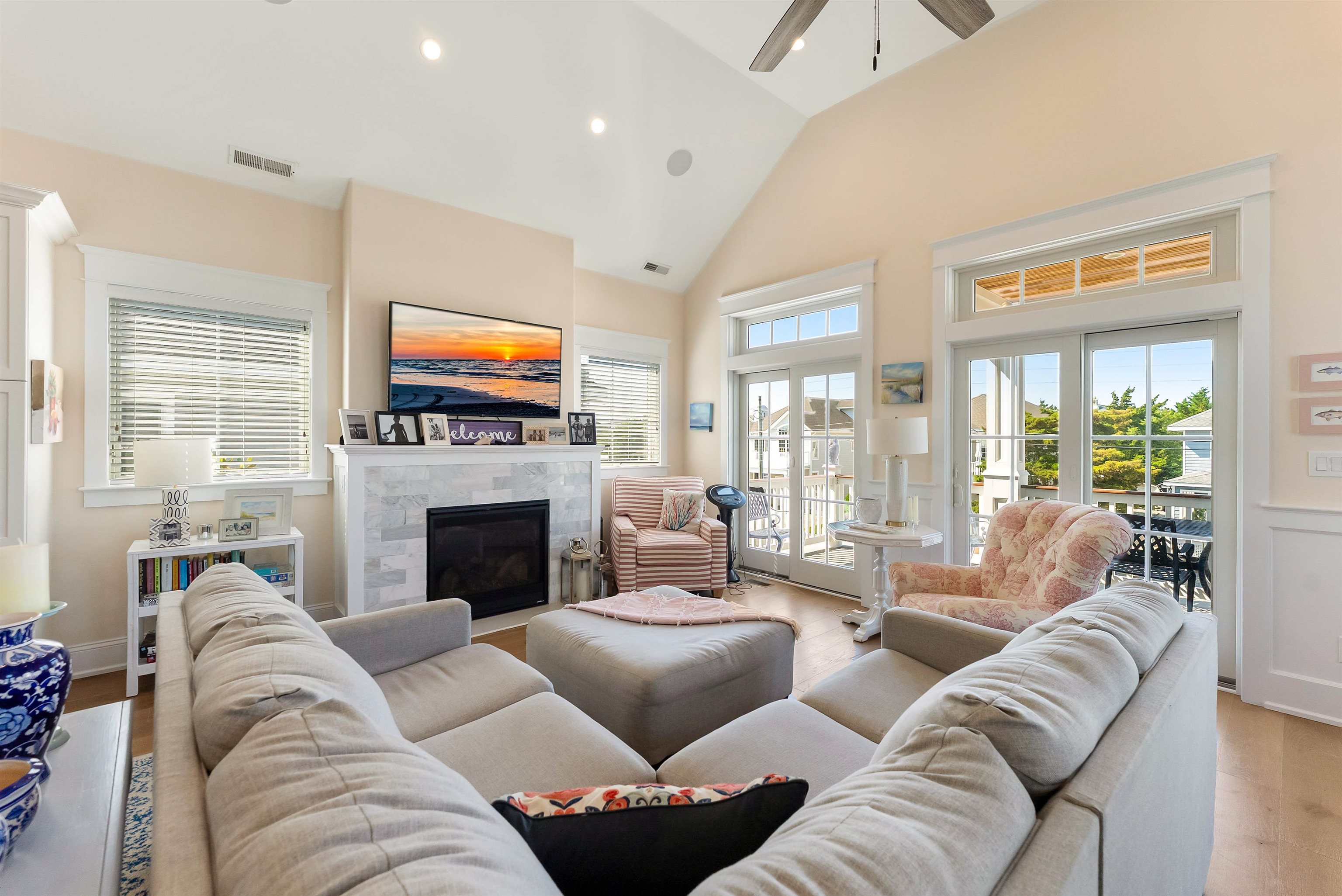 149 10th Street Avalon, NJ 08202 - Photo 20 of 49 a living room with furniture a flat screen tv and a fireplace