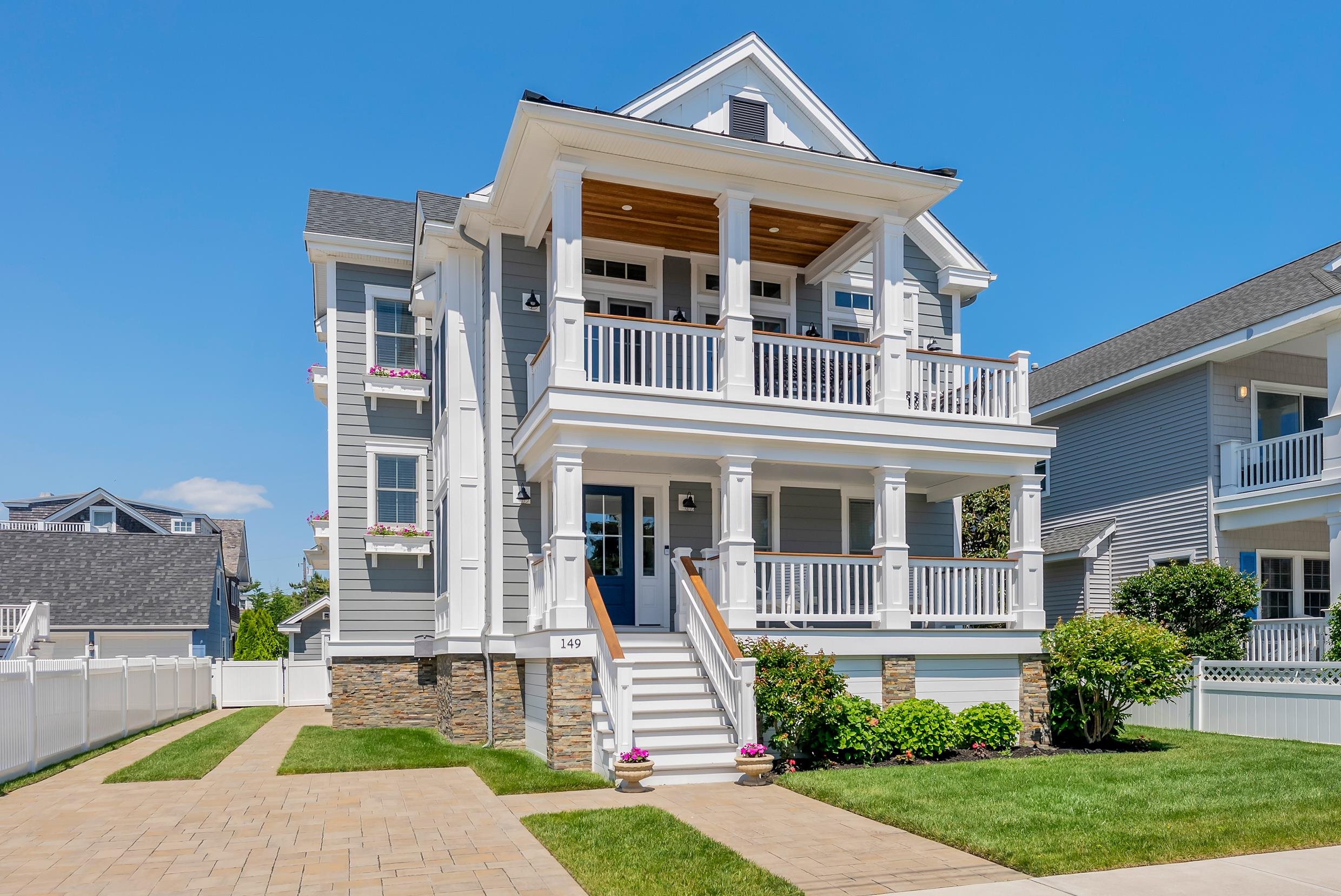 149 10th Street Avalon, NJ 08202 - Photo 2 of 49 a front view of a house with a yard