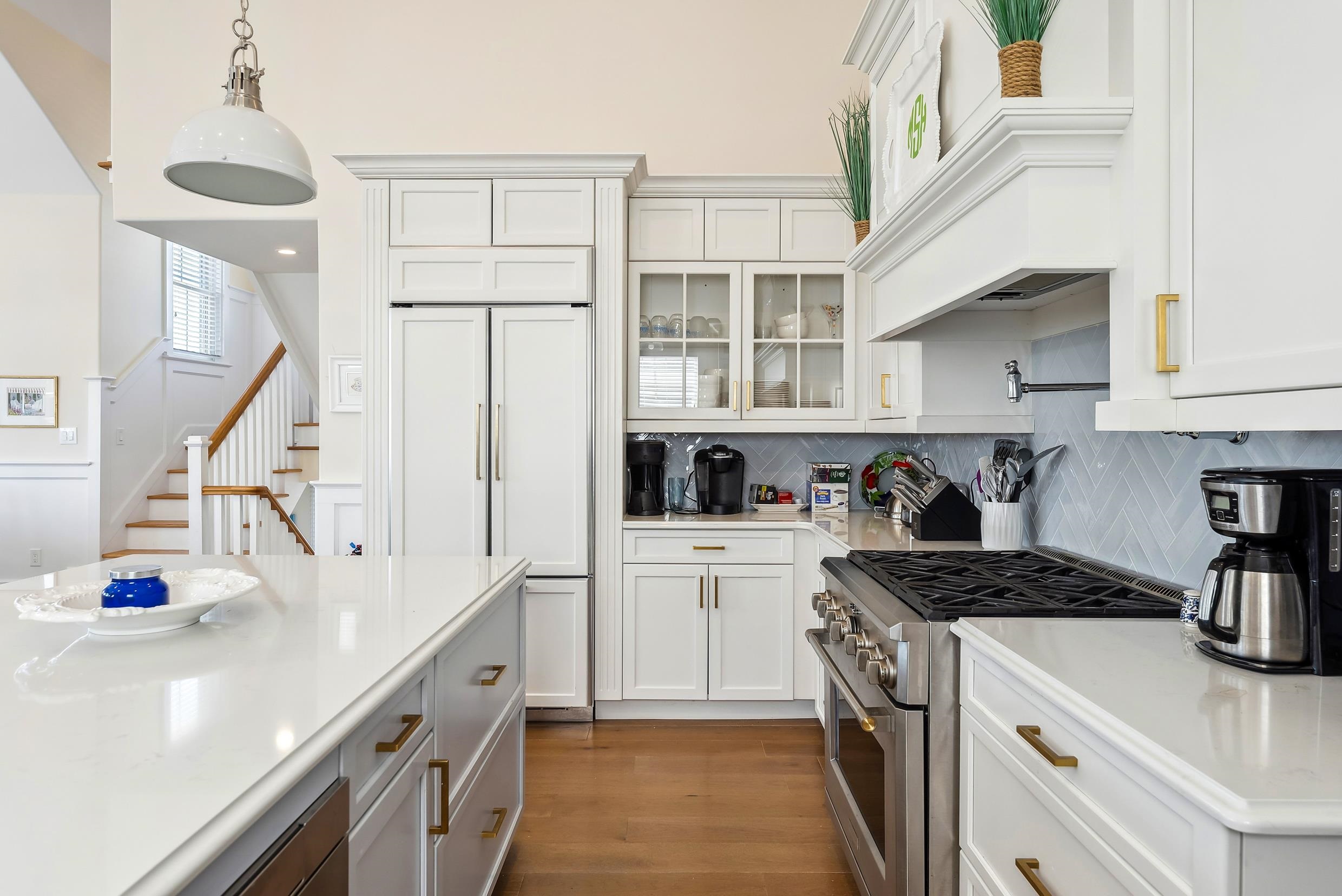 149 10th Street Avalon, NJ 08202 - Photo 27 of 49 a kitchen with a sink cabinets and appliances