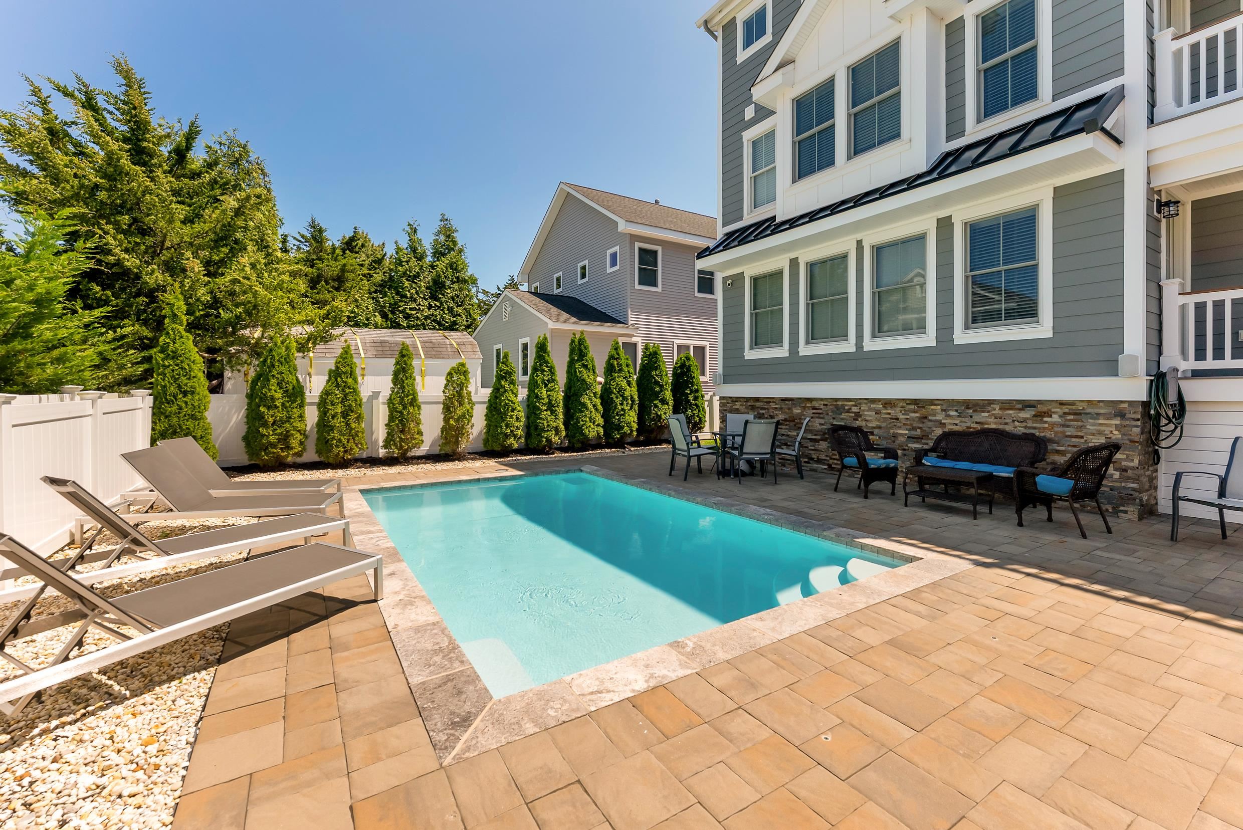 149 10th Street Avalon, NJ 08202 - Photo 3 of 49 a view of a house with swimming pool