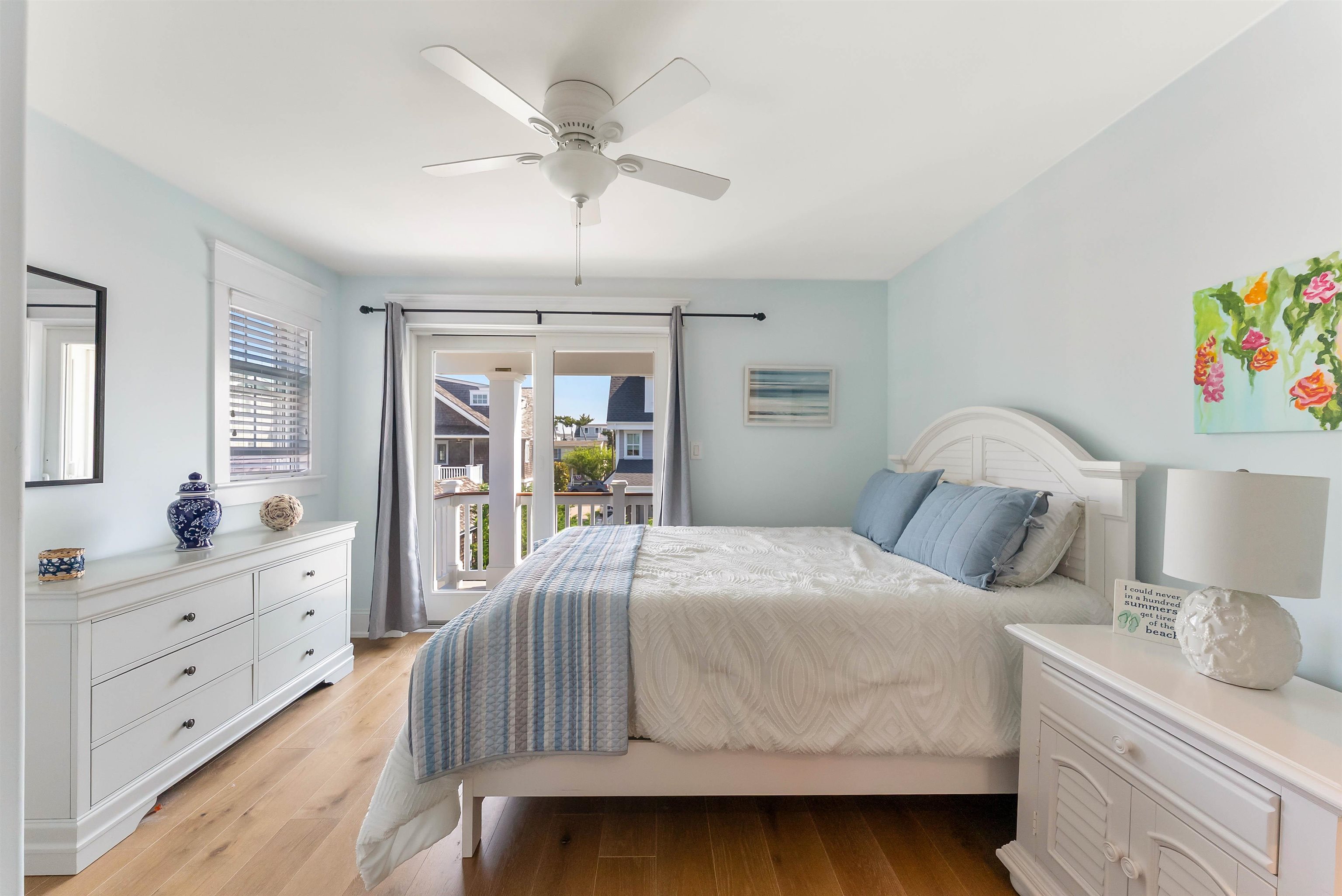 149 10th Street Avalon, NJ 08202 - Photo 35 of 49 a bedroom with a bed and a dresser in it