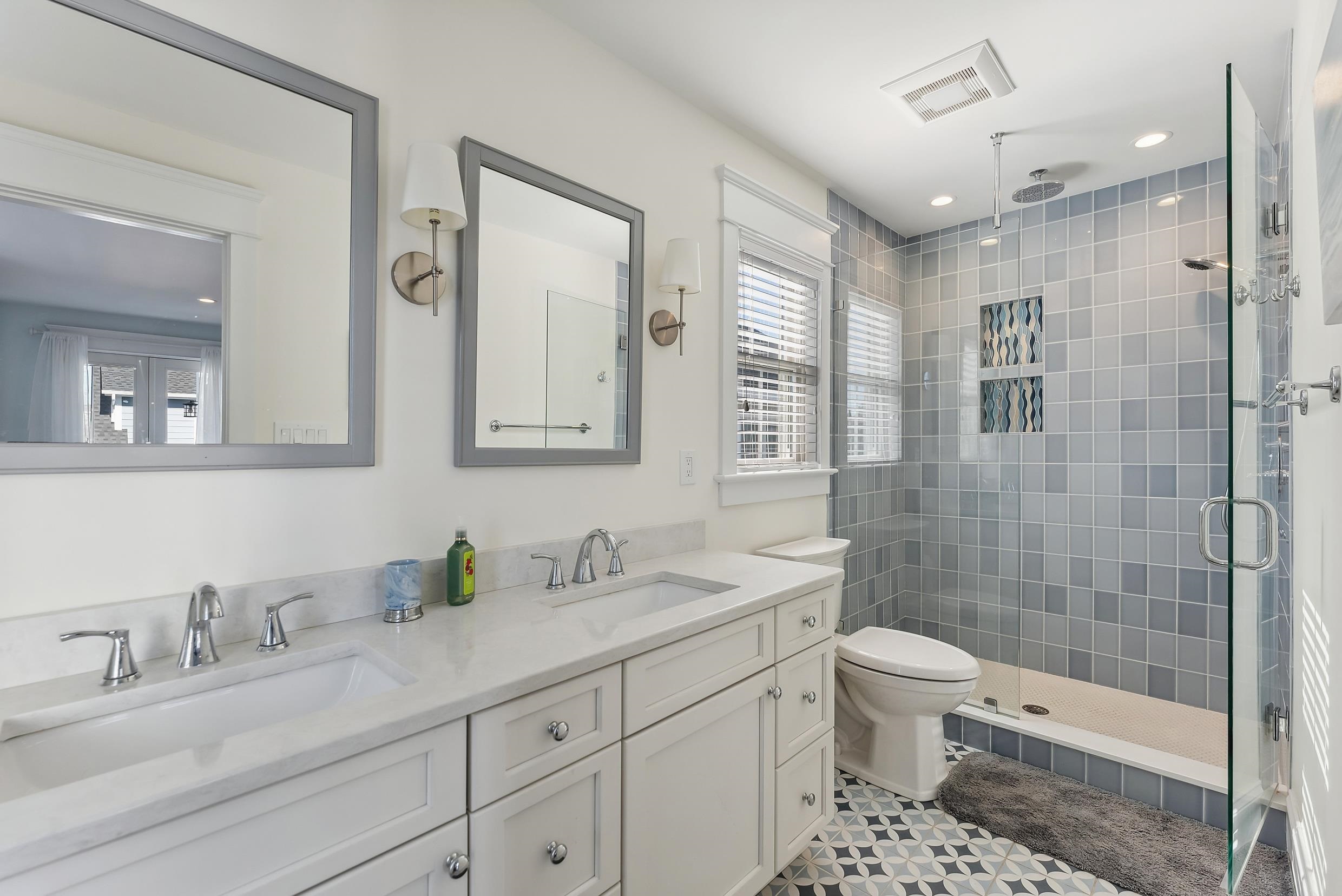 149 10th Street Avalon, NJ 08202 - Photo 40 of 49 a bathroom with a sink a toilet and shower