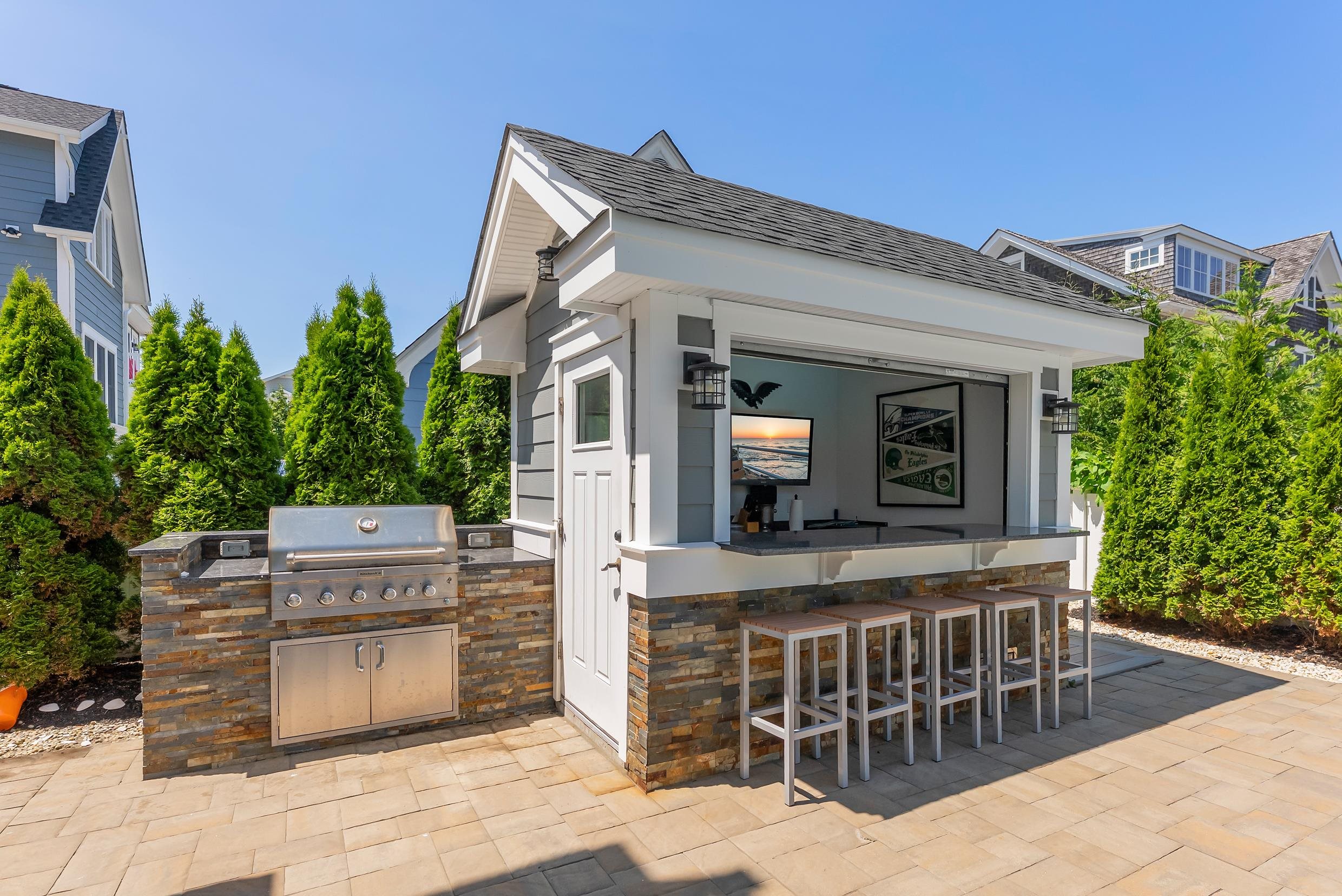 149 10th Street Avalon, NJ 08202 - Photo 44 of 49 a view of a house with a balcony and furniture