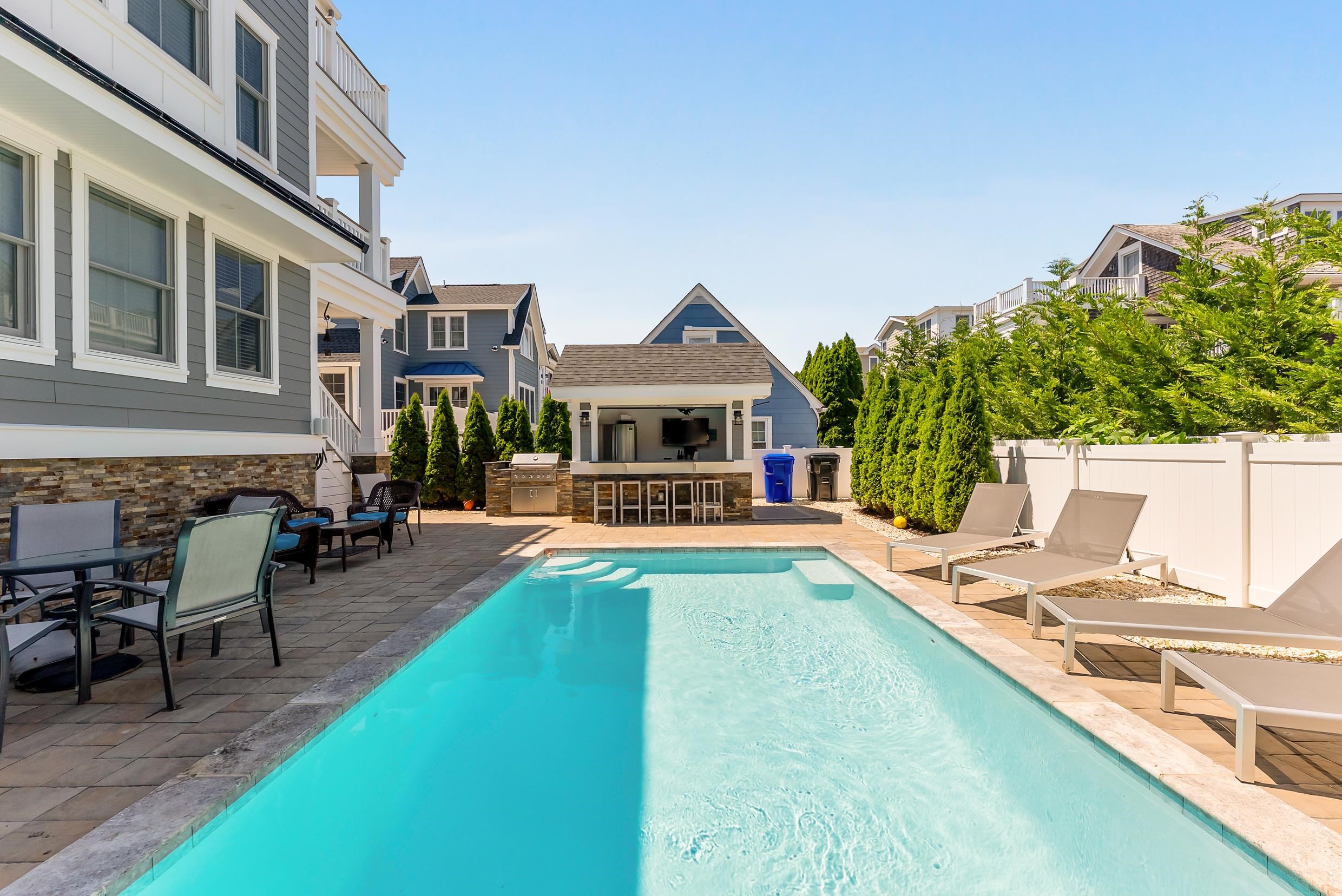 149 10th Street Avalon, NJ 08202 - Photo 48 of 49 a view of a house with swimming pool and sitting area