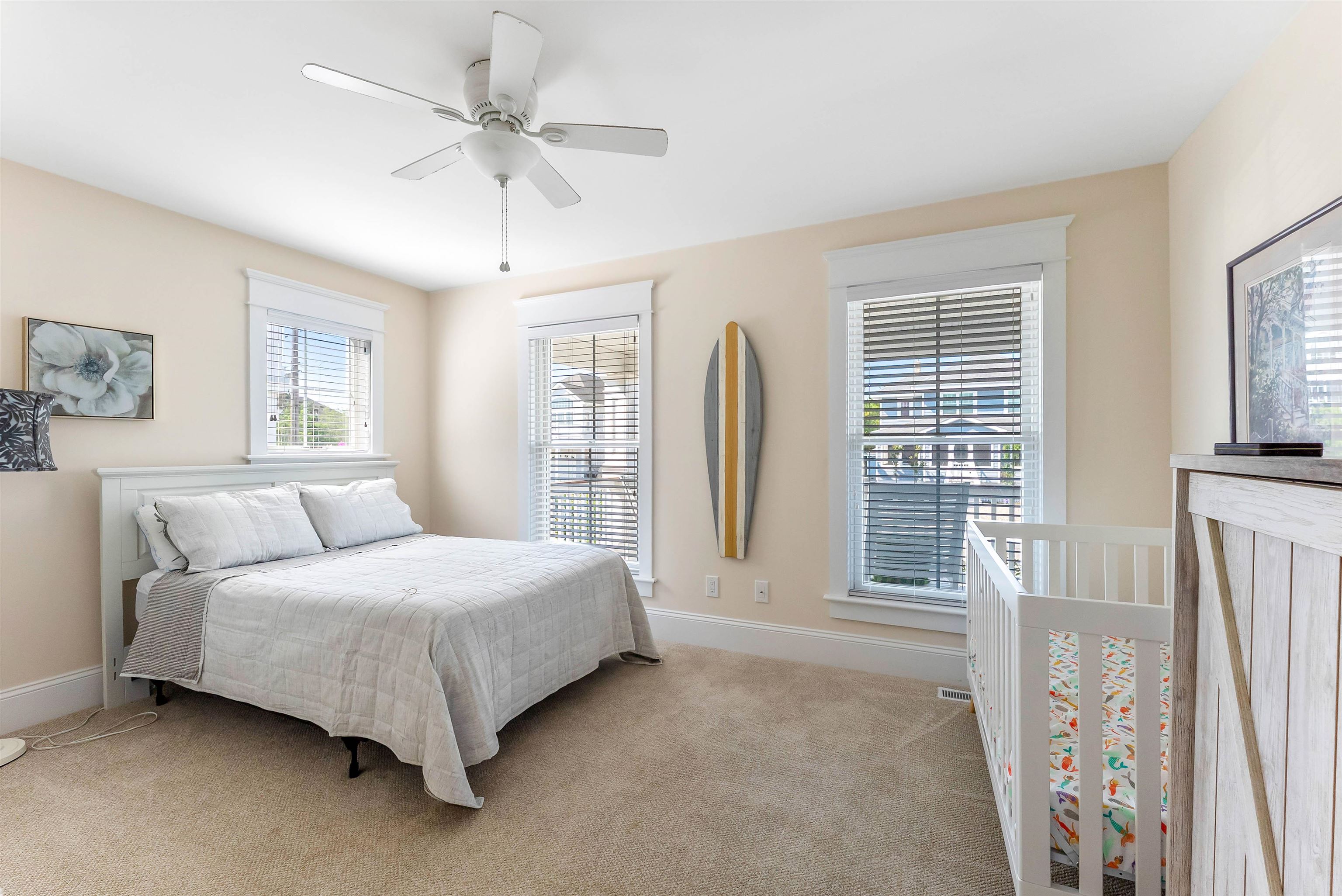 149 10th Street Avalon, NJ 08202 - Photo 7 of 49 a bedroom with a bed and a large window