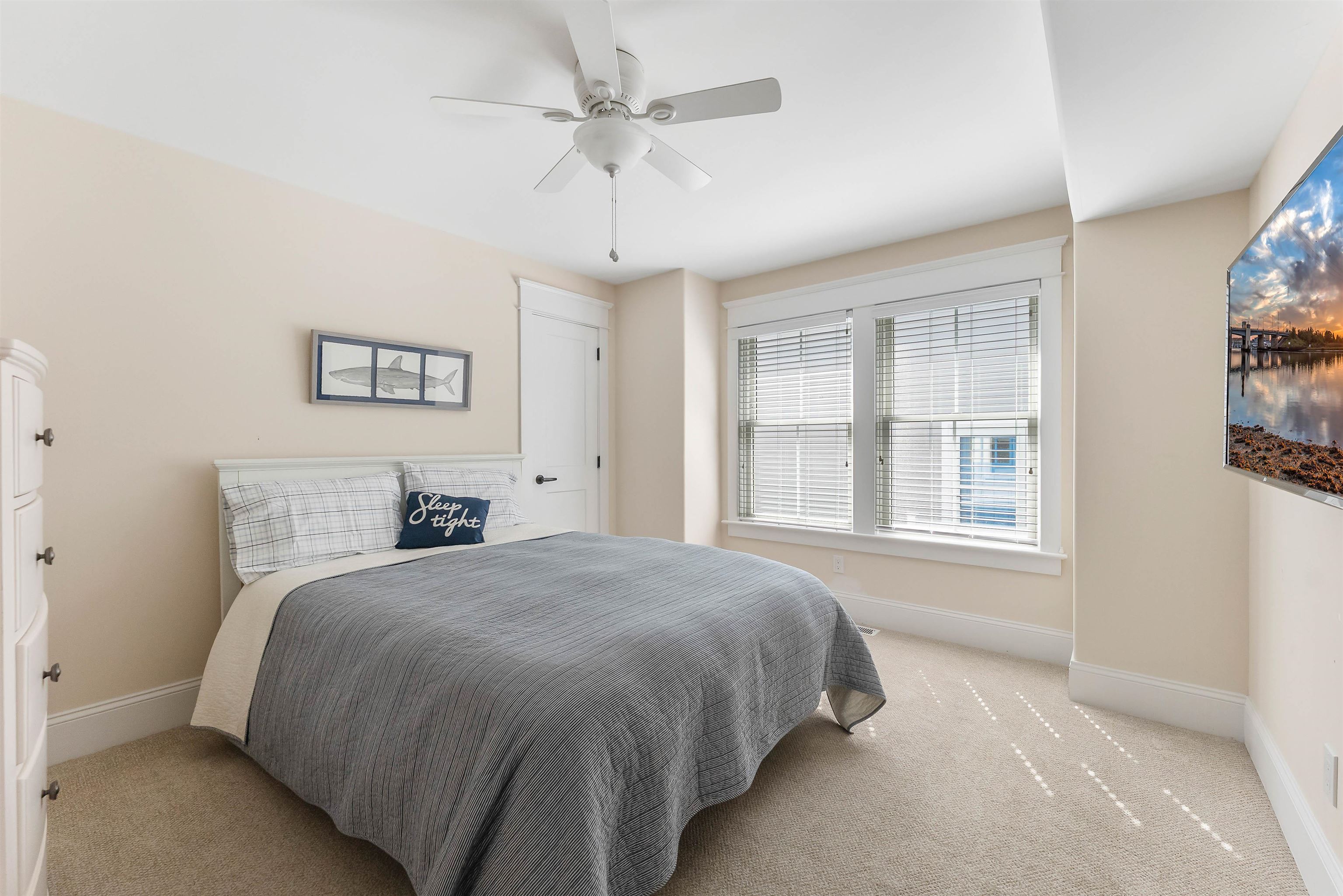 149 10th Street Avalon, NJ 08202 - Photo 10 of 49 a spacious bedroom with a bed and a window
