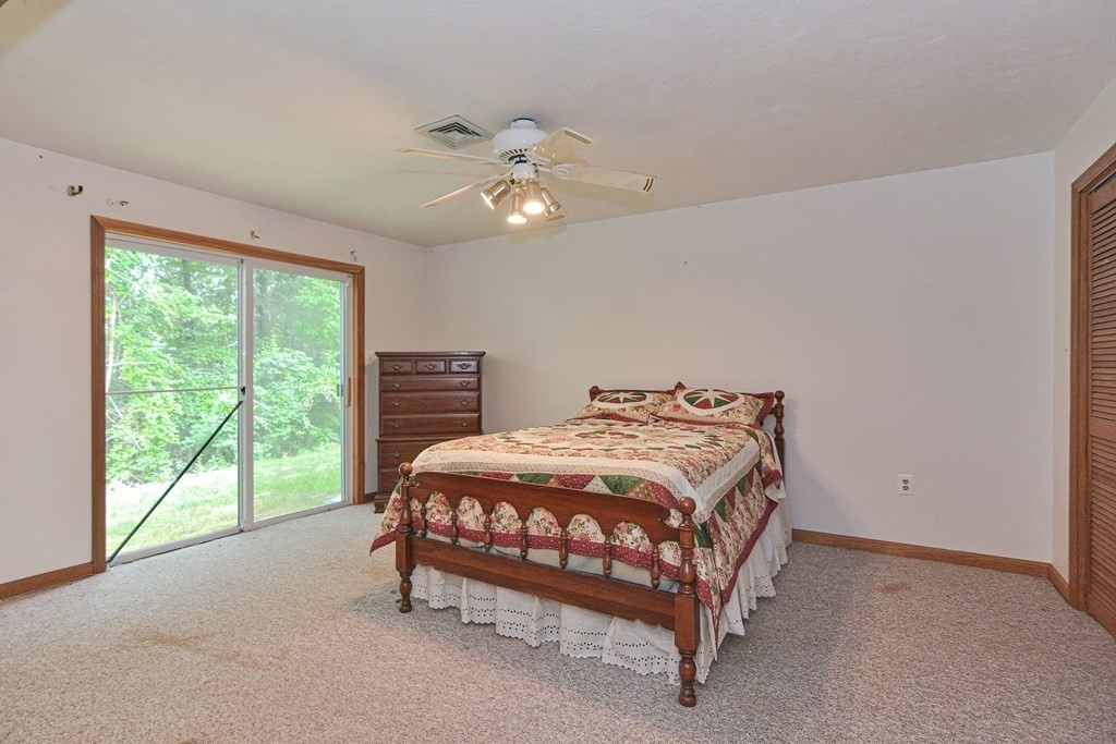 17 Nottingham Road, Unit 17 Grafton, MA 01519 - Photo 11 of 23 a bedroom with a bed and a large window