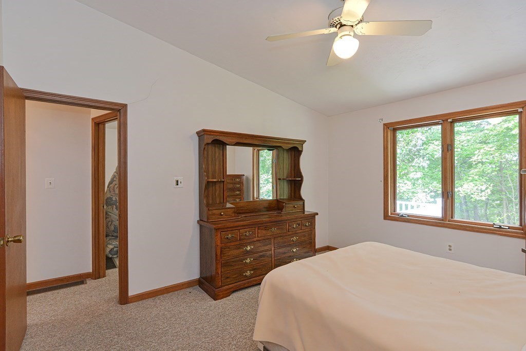 17 Nottingham Road, Unit 17 Grafton, MA 01519 - Photo 12 of 23 a bedroom with a bed and a dresser